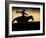 A Silhouetted Cowboy Riding Alone a Ridge at Sunset in Shell, Wyoming, USA-Joe Restuccia III-Framed Photographic Print