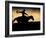 A Silhouetted Cowboy Riding Alone a Ridge at Sunset in Shell, Wyoming, USA-Joe Restuccia III-Framed Photographic Print