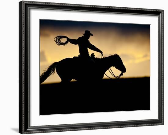 A Silhouetted Cowboy Riding Alone a Ridge at Sunset in Shell, Wyoming, USA-Joe Restuccia III-Framed Photographic Print