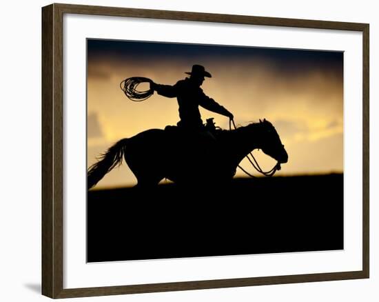 A Silhouetted Cowboy Riding Alone a Ridge at Sunset in Shell, Wyoming, USA-Joe Restuccia III-Framed Photographic Print