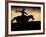 A Silhouetted Cowboy Riding Alone a Ridge at Sunset in Shell, Wyoming, USA-Joe Restuccia III-Framed Photographic Print