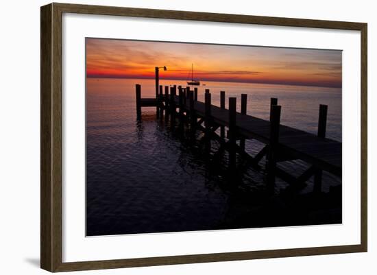 A Single Sailboat Sits on the Water of the Bay Alongside an Empty Dock on Tilghman Island, Maryland-Karine Aigner-Framed Photographic Print