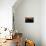 A Single Sailboat Sits on the Water of the Bay Alongside an Empty Dock on Tilghman Island, Maryland-Karine Aigner-Photographic Print displayed on a wall