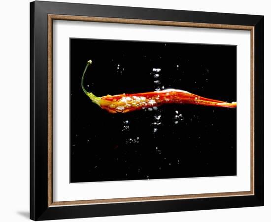 A Sliced Open Chilli Pepper in Water-null-Framed Photographic Print