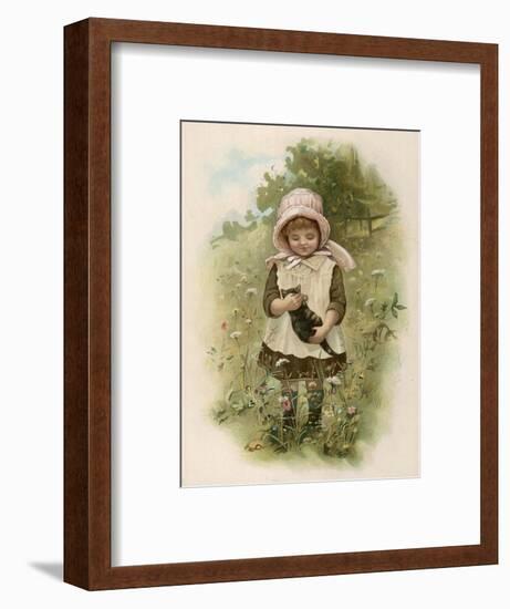 A Small Girl Plays with Her Kitten in a Meadow-null-Framed Art Print