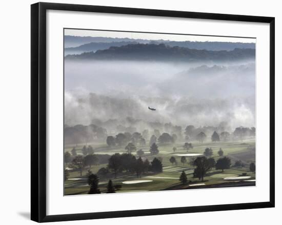 A Small Plane Descends Over Fog Covered Reeves Municipal Golf Course as It Lands at Lunken Airport-null-Framed Photographic Print