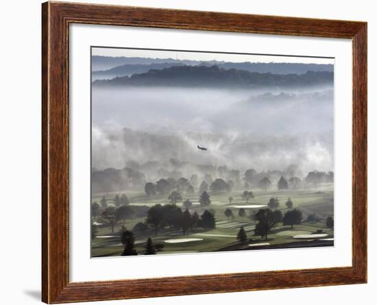 A Small Plane Descends Over Fog Covered Reeves Municipal Golf Course as It Lands at Lunken Airport-null-Framed Photographic Print