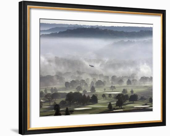 A Small Plane Descends Over Fog Covered Reeves Municipal Golf Course as It Lands at Lunken Airport-null-Framed Photographic Print