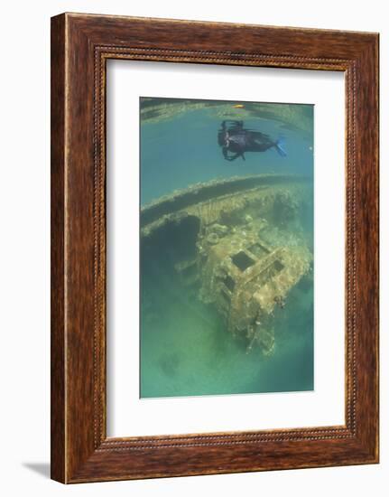 A Snorkeler Swims Above a Shipwreck in Palau's Inner Lagoon-Stocktrek Images-Framed Photographic Print