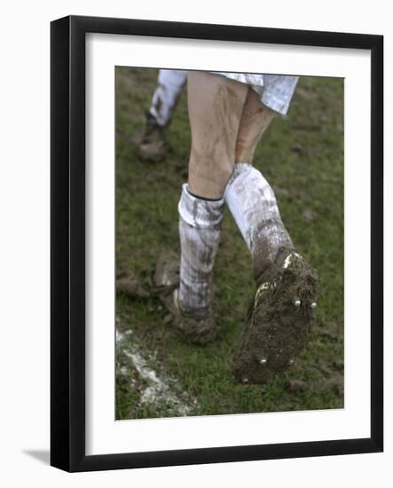 A Soccer Player's Muddy Cleats-null-Framed Photographic Print