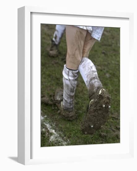 A Soccer Player's Muddy Cleats-null-Framed Photographic Print