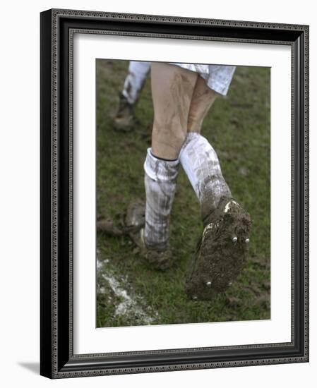 A Soccer Player's Muddy Cleats-null-Framed Photographic Print