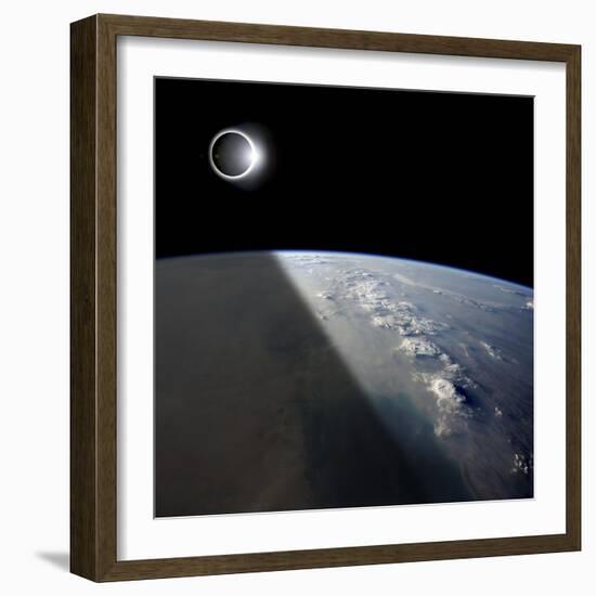 A Solar Eclipses Partially Shades the Earth Below-Stocktrek Images-Framed Photographic Print