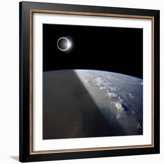 A Solar Eclipses Partially Shades the Earth Below-Stocktrek Images-Framed Photographic Print