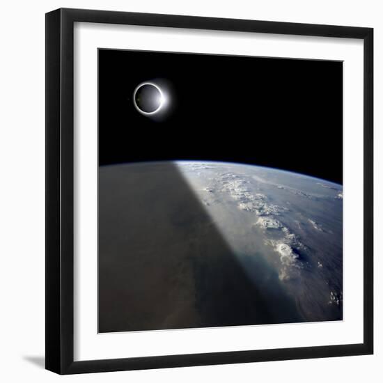 A Solar Eclipses Partially Shades the Earth Below-Stocktrek Images-Framed Photographic Print