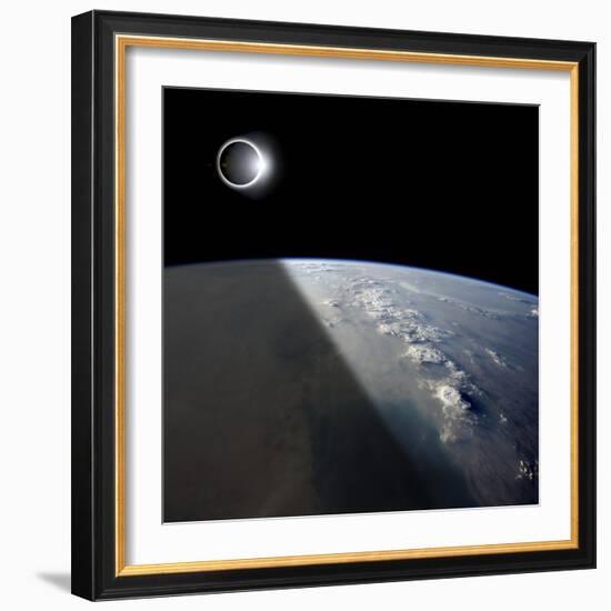 A Solar Eclipses Partially Shades the Earth Below-Stocktrek Images-Framed Photographic Print