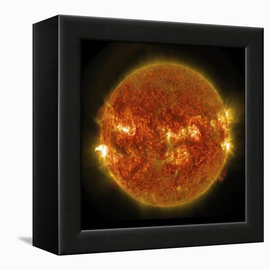 A Solar Flare Erupting on the Left Side of the Sun-null-Framed Stretched Canvas