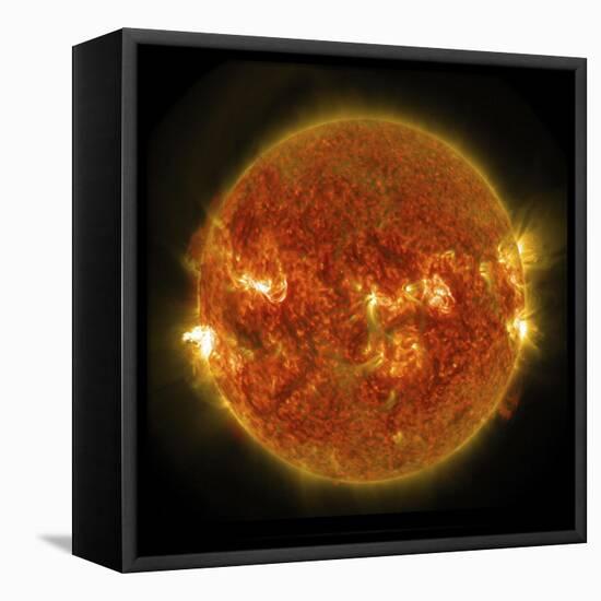 A Solar Flare Erupting on the Left Side of the Sun-null-Framed Stretched Canvas