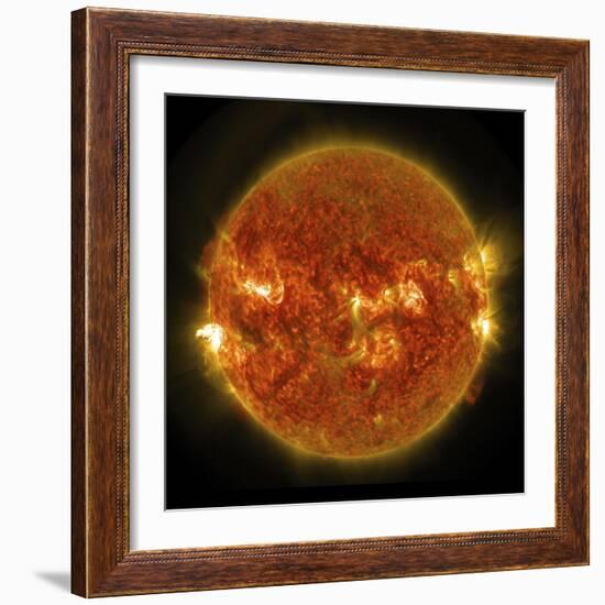 A Solar Flare Erupting on the Left Side of the Sun-null-Framed Art Print