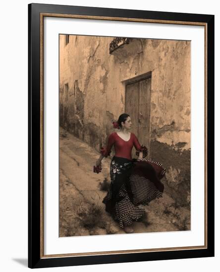 A Spanish Woman Walking Along a Traditional Spanish Street Wearing a Flamenco Style Dress-Steven Boone-Framed Photographic Print