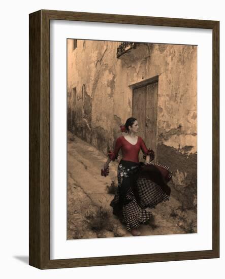 A Spanish Woman Walking Along a Traditional Spanish Street Wearing a Flamenco Style Dress-Steven Boone-Framed Photographic Print