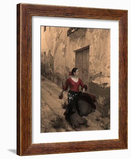 A Spanish Woman Walking Along a Traditional Spanish Street Wearing a Flamenco Style Dress-Steven Boone-Framed Photographic Print