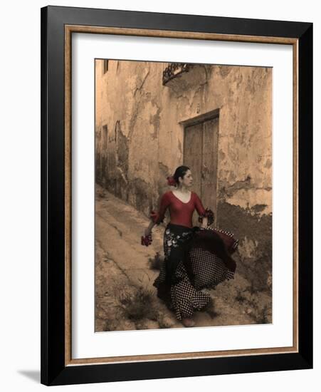 A Spanish Woman Walking Along a Traditional Spanish Street Wearing a Flamenco Style Dress-Steven Boone-Framed Photographic Print