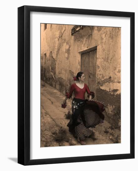 A Spanish Woman Walking Along a Traditional Spanish Street Wearing a Flamenco Style Dress-Steven Boone-Framed Photographic Print