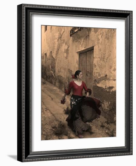A Spanish Woman Walking Along a Traditional Spanish Street Wearing a Flamenco Style Dress-Steven Boone-Framed Photographic Print