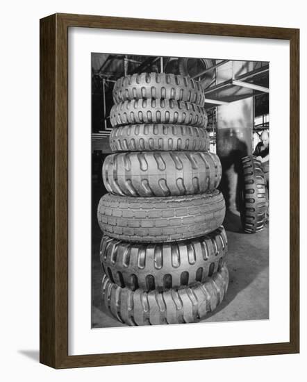 A Stack of Huge Earthmover and Combat Vehicle Tires Showing Deep Treads-null-Framed Photographic Print