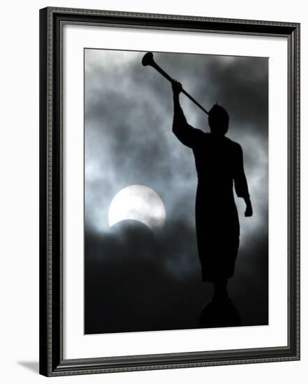 A Statue is Seen against a Cloudy Sky and a Partial Solar Eclipse-null-Framed Photographic Print