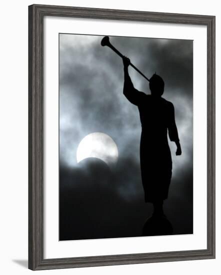 A Statue is Seen against a Cloudy Sky and a Partial Solar Eclipse-null-Framed Photographic Print