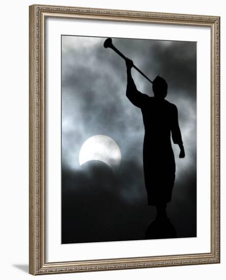 A Statue is Seen against a Cloudy Sky and a Partial Solar Eclipse-null-Framed Photographic Print