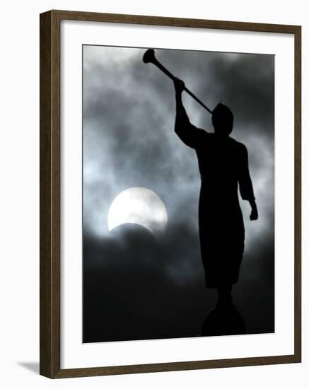 A Statue is Seen against a Cloudy Sky and a Partial Solar Eclipse-null-Framed Photographic Print