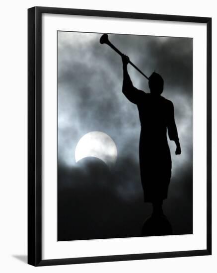 A Statue is Seen against a Cloudy Sky and a Partial Solar Eclipse-null-Framed Photographic Print