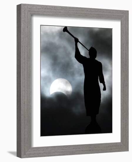 A Statue is Seen against a Cloudy Sky and a Partial Solar Eclipse-null-Framed Photographic Print