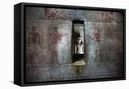 A Statue Through a Window in a Bas Relief Covered Wall in the Tomb of Ti-Alex Saberi-Framed Premier Image Canvas