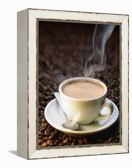 A Steaming Cup of Coffee on Coffee Beans-Peter Sapper-Framed Premier Image Canvas