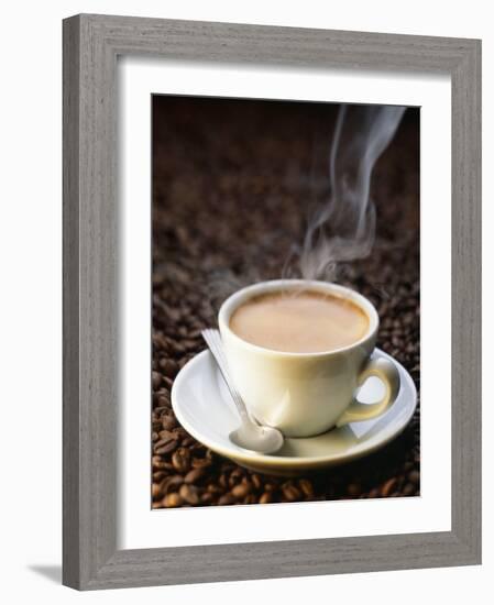 A Steaming Cup of Coffee on Coffee Beans-Peter Sapper-Framed Photographic Print