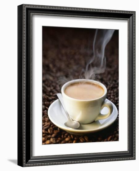 A Steaming Cup of Coffee on Coffee Beans-Peter Sapper-Framed Photographic Print