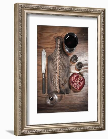 A Still Life Featuring a Fish Skeleton, Pomegranate and Red Wine-Komar-Framed Photographic Print