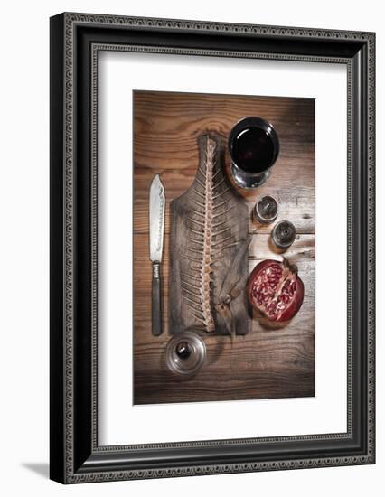 A Still Life Featuring a Fish Skeleton, Pomegranate and Red Wine-Komar-Framed Photographic Print