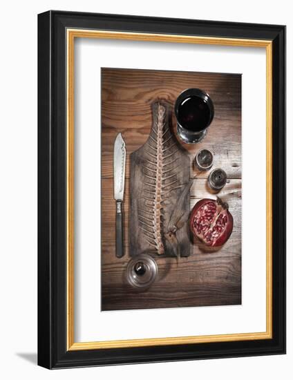 A Still Life Featuring a Fish Skeleton, Pomegranate and Red Wine-Komar-Framed Photographic Print