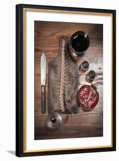 A Still Life Featuring a Fish Skeleton, Pomegranate and Red Wine-Komar-Framed Photographic Print