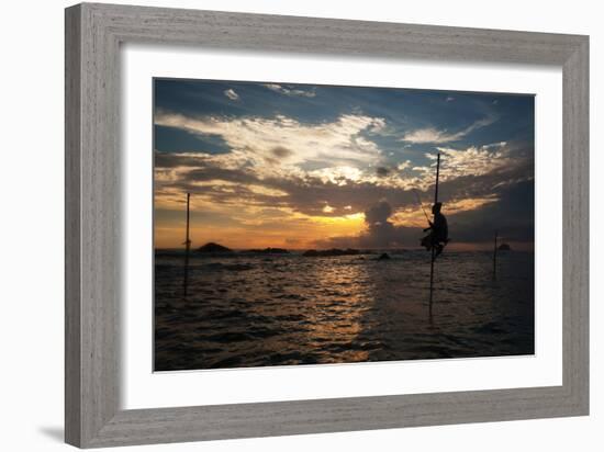 A Stilt Fisherman at Sunset-Alex Saberi-Framed Photographic Print