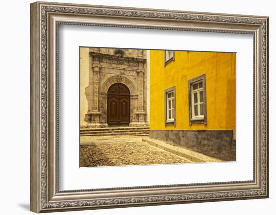 A Street in Tavira Leading to the Entrance of a Church.-Julianne Eggers-Framed Photographic Print