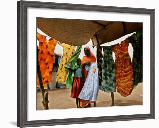 A Sudanese Woman Buys a Dress for Her Daughter at the Zamzam Refugee Camp-null-Framed Photographic Print