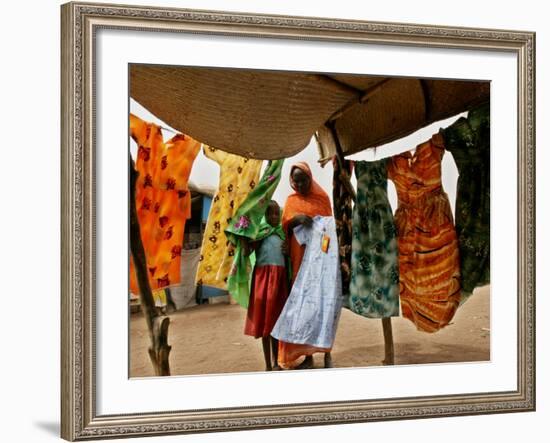 A Sudanese Woman Buys a Dress for Her Daughter at the Zamzam Refugee Camp-null-Framed Photographic Print