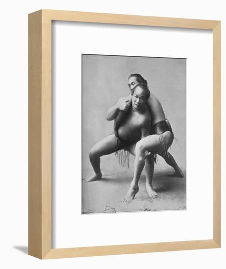 A sumo wrestling bout between a pair of Japanese professionals, 1902-Unknown-Framed Photographic Print