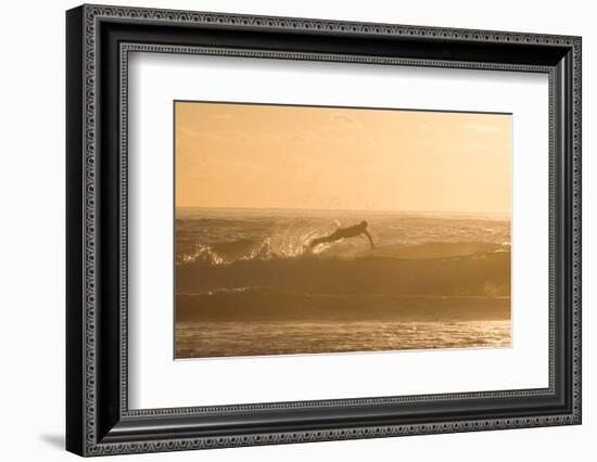 A Surfer Dives over a Wave on Praia Da Joaquina Beach on Florianopolis Island-Alex Saberi-Framed Photographic Print